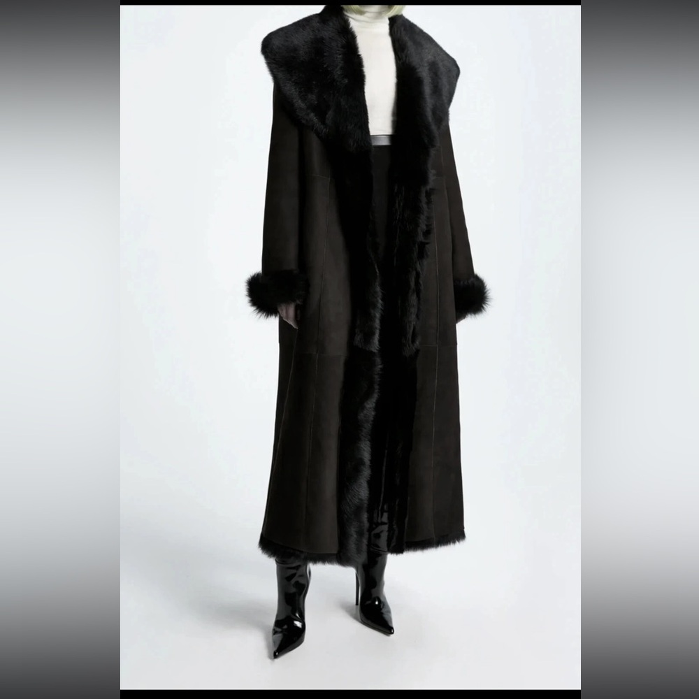 Luxurious Black DKNY 100% shearling fully lined. Suede on the outside.